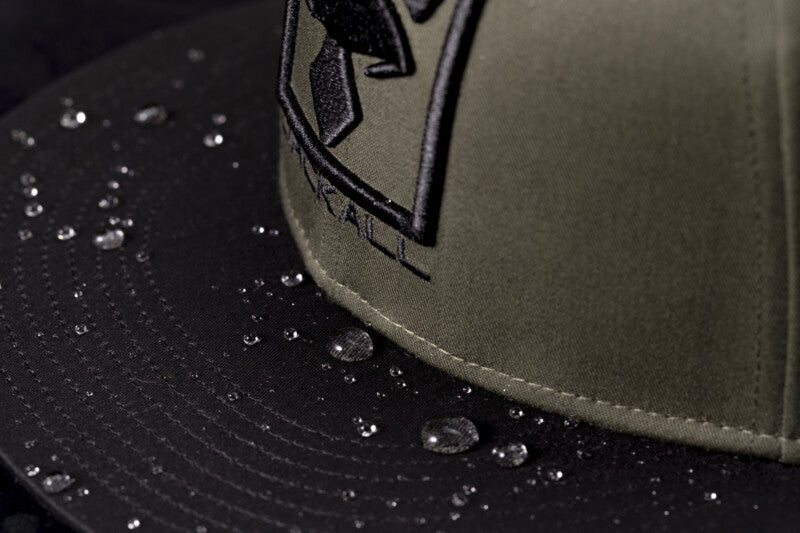 Water repellent flat bill cap